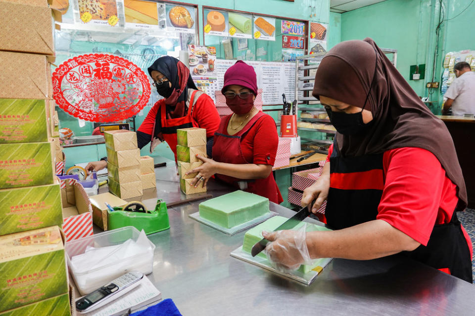 Workers of Pandan Layer Bakery busy preparing their signature pandan layer cake for customers during the movement control order 3.0 (MCO 3.0) in Klang June 23, 2021.