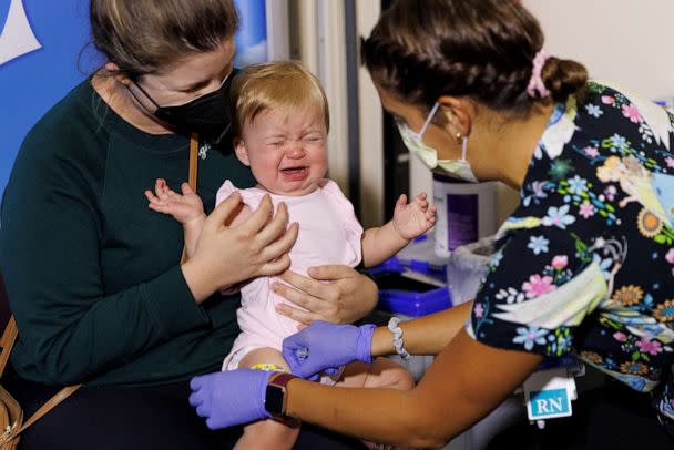 PHOTO: Following CDC approval for vaccination of children aged 6 months to 5 years, 10-month-old Hazel Ribnik reacts, as nurse Jillian Mercer administers the vaccine for COVID-19 at Rady Children's Hospital in San Diego, June 21, 2022. (Mike Blake/Reuters, FILE)