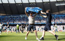 <p>Soccer Football – Premier League – Manchester City vs Huddersfield Town – Etihad Stadium, Manchester, Britain – May 6, 2018 Manchester City fans celebrate winning the premier league on the pitch after the end of the match Action Images via Reuters/Carl Recine EDITORIAL USE ONLY. No use with unauthorized audio, video, data, fixture lists, club/league logos or “live” services. Online in-match use limited to 75 images, no video emulation. No use in betting, games or single club/league/player publications. Please contact your account representative for further details. </p>