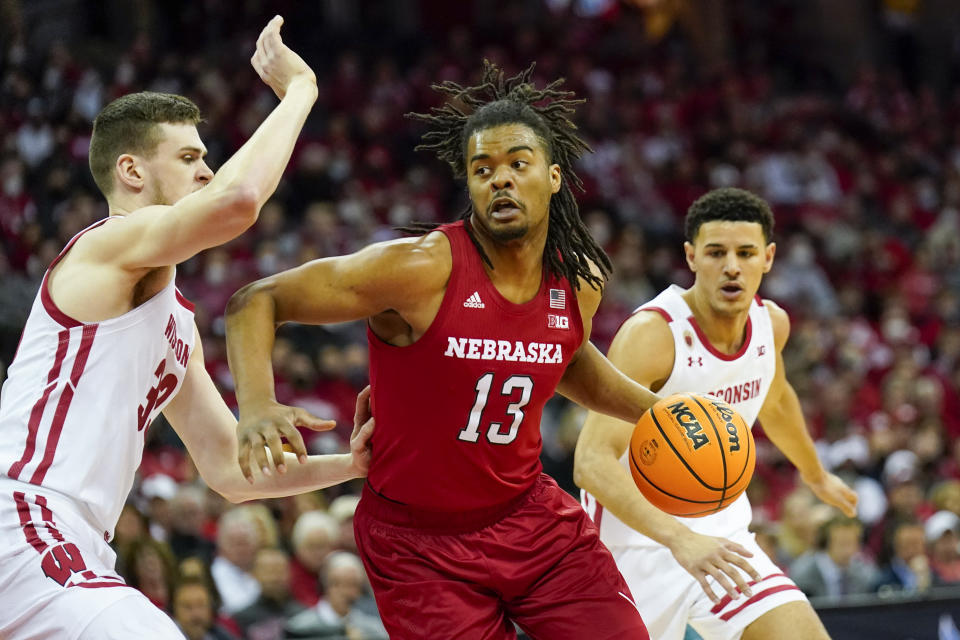 FILE - Nebraska's Derrick Walker (13) drives against Wisconsin's Chris Vogt (33) and Johnny Davis during the first half of an NCAA college basketball game Sunday, March 6, 2022, in Madison, Wis. Walker is the top returning scorer and rebounder. (AP Photo/Andy Manis)
