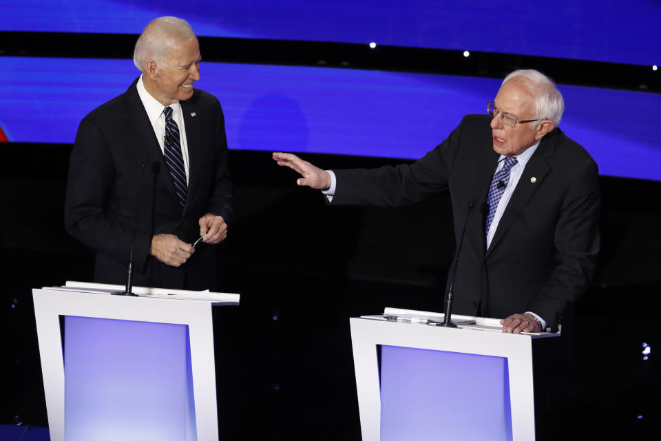 Democratic presidential candidate Sen. Bernie Sanders, I-Vt., speaks as former Vice President Joe Biden looks on Tuesday, Jan. 14, 2020, during a Democratic presidential primary debate hosted by CNN and the Des Moines Register in Des Moines, Iowa. (AP Photo/Patrick Semansky)