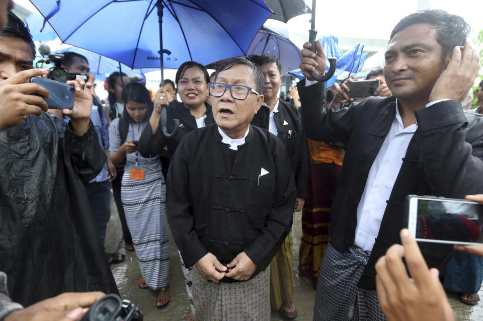Khin Maung Zaw, center, lawyer of rape suspect Aung Kyaw Myo, talks to journalists after the court appearance Wednesday, July 24, 2019, in Naypyitaw, Myanmar. A Myanmar court held another hearing related to the rape of a 2-year old girl at her nursery school, in a case that generated huge interest and protests. (AP Photo/Aung Shine Oo)
