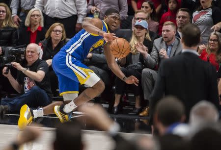 May 20, 2019; Portland, OR, USA; Golden State Warriors center Kevon Looney (5) dives to save the basketball from going out of bound during the second half against the Portland Trail Blazers in game four of the Western conference finals of the 2019 NBA Playoffs at Moda Center. The Warriors won 119-117 in overtime. Mandatory Credit: Troy Wayrynen-USA TODAY Sports