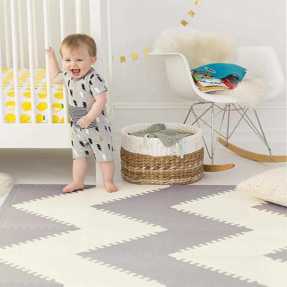 If your tiny tot is crawling around, these mat tiles are made with thick foam that'll feel soft on their hands and feet. Plus, it'll go with any room decor setup!<br /><br /><strong>Promising Review:</strong> "Goes great with my living room decor/color scheme, and so much more attractive than any other play mat I've seen. I get many compliments! <strong>Sufficiently thick with enough protection for inevitable head bumps. Really helps prevent my living room from being overtaken by baby stuff &mdash; the play mat defines and confines the play space</strong> &mdash; and helps me maintain my sophisticated living room as an adult-friendly space." &mdash; <a href="https://amzn.to/3oYIz3Z" target="_blank" rel="nofollow noopener noreferrer" data-skimlinks-tracking="5315000" data-vars-affiliate="Amazon" data-vars-href="https://www.amazon.com/gp/customer-reviews/R2REF0NVDY1ZIM?tag=bfjohn-20&amp;ascsubtag=5315000%2C12%2C22%2Cmobile_web%2C0%2C0%2C67722" data-vars-keywords="cleaning" data-vars-link-id="67722" data-vars-price="" data-vars-product-id="15961767" data-vars-retailers="Amazon">LBM202<br /><br /></a><a href="https://amzn.to/2TiOYvc" target="_blank" rel="noopener noreferrer"><strong>Get it from Amazon for $78.99+ (available in two colors).</strong></a> 