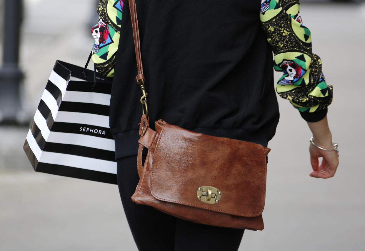 FILE - In this March 23, 2016, file photo, a shopper walks out of the Sephora store in the Shadyside section of Pittsburgh. Sephora is closing its U.S. stores for an hour Wednesday, June 5, 2019, to host “inclusion workshops” for its 16,000 employees, just over a month after R&B star SZA said she had security called on her while shopping at a store in California. (AP Photo/Gene J. Puskar, File)