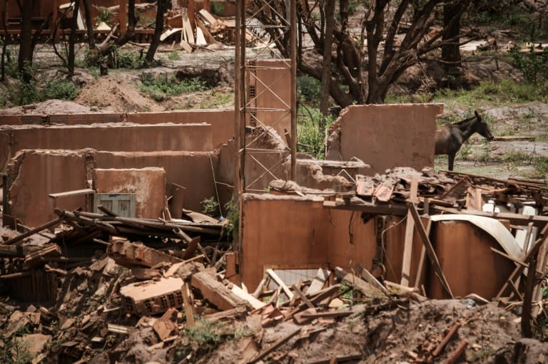 Remains of houses damaged by the flood following the deadly collapse of the Samarco iron-ore mine dam last year