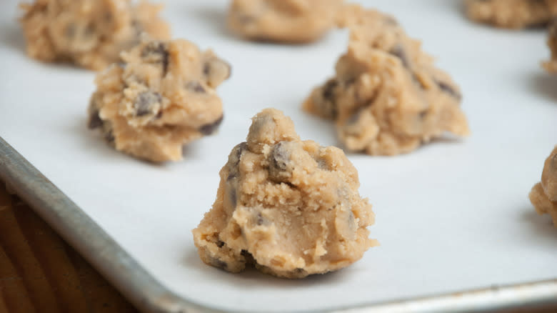 Cookie dough mounds on baking sheet