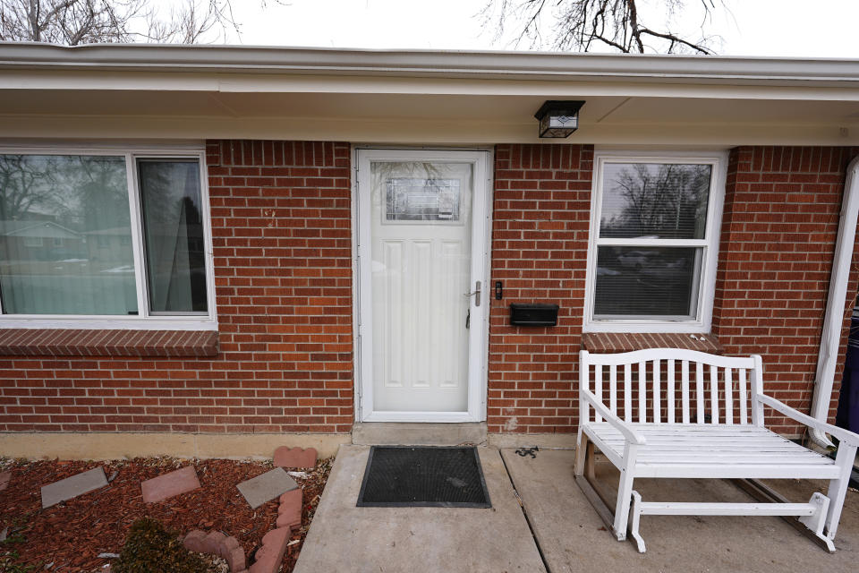 The residence where a former funeral home owner kept a deceased women's body in a hearse for two years as well as the remains of 30 cremated people is shown Friday, Feb. 16, 2024, in southwest Denver. The discovery occurred on Feb. 6 during a court-ordered eviction of the home rented by 33-year-old Miles Harford, who authorities have issued an arrest warrant for. (AP Photo/David Zalubowski)