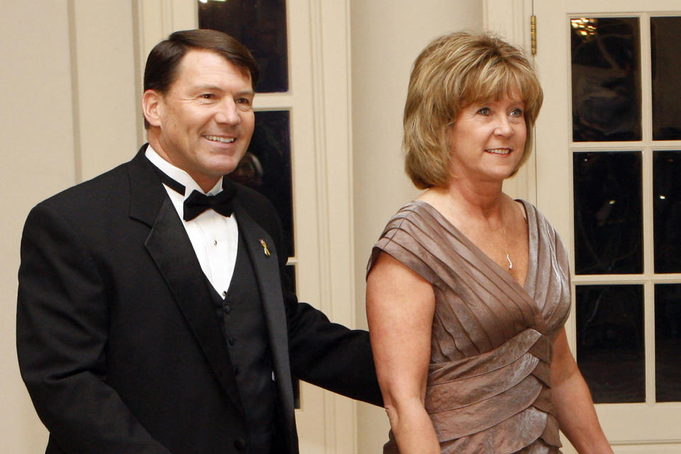 FILE - In this Feb. 22, 2009, file photo, South Dakota Gov. Mike Rounds, left, and his wife, Jean, arrive at the White House to attend a dinner hosted by President Barack Obama, in Washington. Jean Rounds, the wife of Republican Sen. Mike Rounds of South Dakota, died Tuesday, Nov. 2, 2021. She was 65. (AP Photo/Pablo Martinez Monsivais, File)