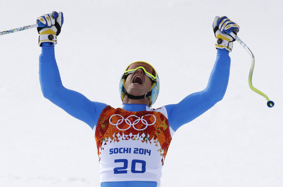 Italy's Christof Innerhofer celebrates after finishing the men's downhill at the Sochi 2014 Winter Olympics, Sunday, Feb. 9, 2014, in Krasnaya Polyana, Russia. (AP Photo/Christophe Ena)