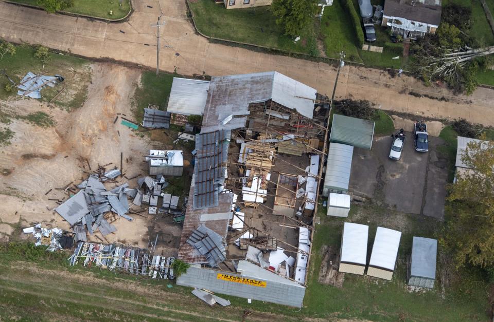 Damage to a roof from Hurricane Laura is seen Friday, Aug. 28, 2020, in Pineville, La., during Gov. John Bel Edwards' aerial tour of stricken areas in the northern part of the state. (Bill Feig/The Advocate via AP, Pool)