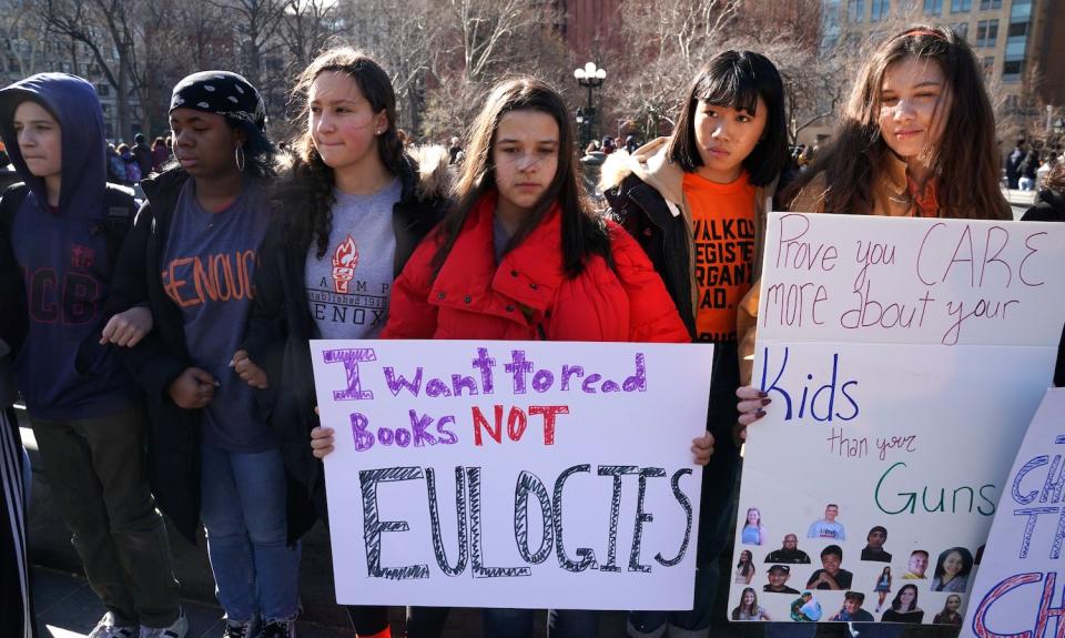 <p>Students from Harvest Collegiate High School form a circle around the fountain in Washington Square Park on March 14, 2018, in New York City to take part in a national walkout to protest gun violence, one month after the shooting in Parkland, Fla., in which 17 people were killed. (Photo: Getty Images) </p>