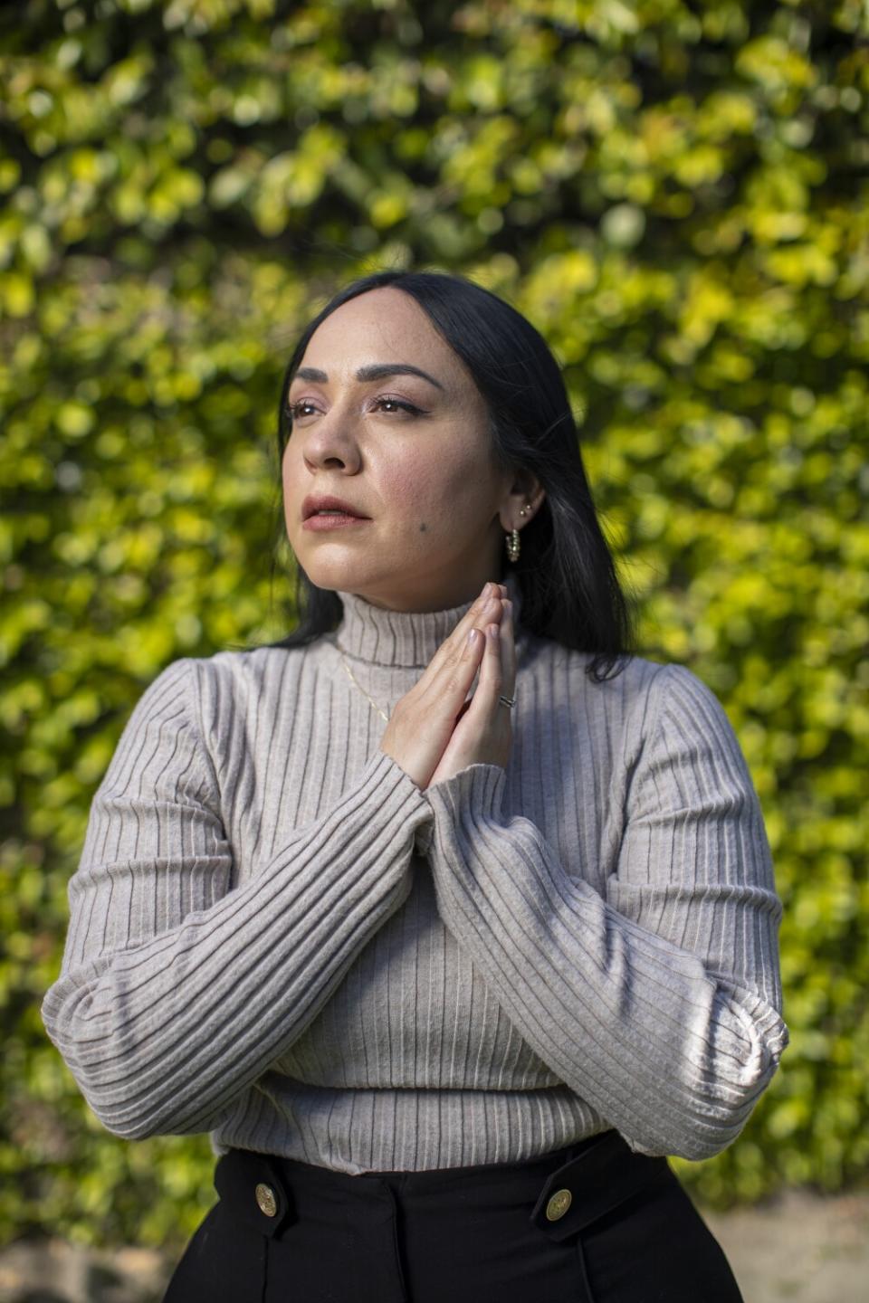 Singer songwriter Carla Morrison poses with her hands together