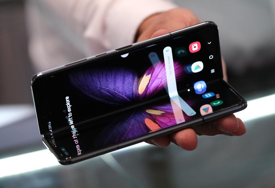 A host displays the new Samsung Galaxy Fold smartphone at the 2019 IFA home electronics and appliances trade fair on Sept. 5, 2019 in Berlin, Germany. The 2019 IFA fair will be open to the public from Sept. 6-11. 