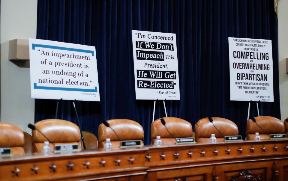 Signs with quotes from Democratic members of Congress sit behind Republican seats on the committee dais before the start of a House Judiciary Committee hearing on the impeachment Inquiry into U.S. President Donald Trump on Capitol Hill