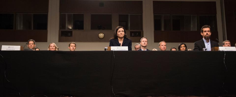 An empty chair on the left marks the&nbsp;absence of anyone from Google as Facebook COO Sheryl Sandberg and Twitter CEO Jack Dorsey answered questions from members of the Senate Intelligence Committee on Wednesday. (Photo: JIM WATSON via Getty Images)