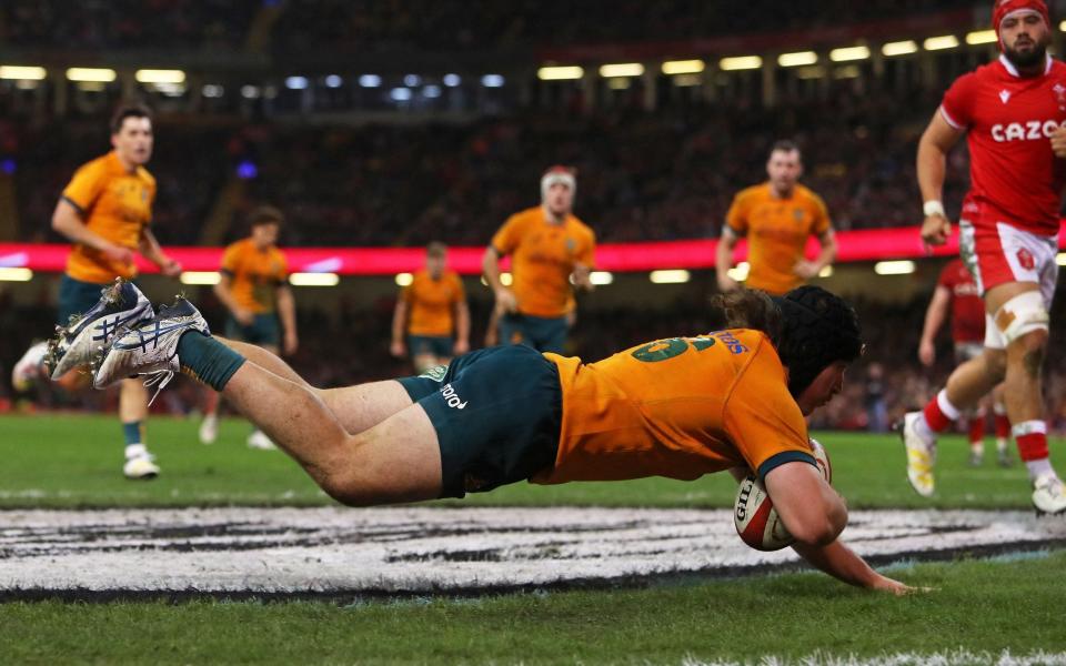 Australia's Lachlan Lonergan scores the winning try to round off a stunning comeback in Cardiff - Geoff Caddick/AFP