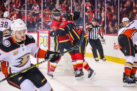 Feb 22, 2019; Calgary, Alberta, CAN; Calgary Flames left wing Andrew Mangiapane (88) celebrates with right wing Garnet Hathaway (21) after scoring a goal during the third period against the Anaheim Ducks at Scotiabank Saddledome. Mandatory Credit: Sergei Belski-USA TODAY Sports