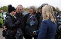 Charlotte Charles (left), the mother of Harry Dunn, Bruce Charles, and Tracey Dunn speak to media after a motorbike convoy followed Harry Dunn's last ride through Brackley as a tribute to the teenager who died when his motorbike was involved in a head-on collision near RAF Croughton, Northamptonshire, in August.
