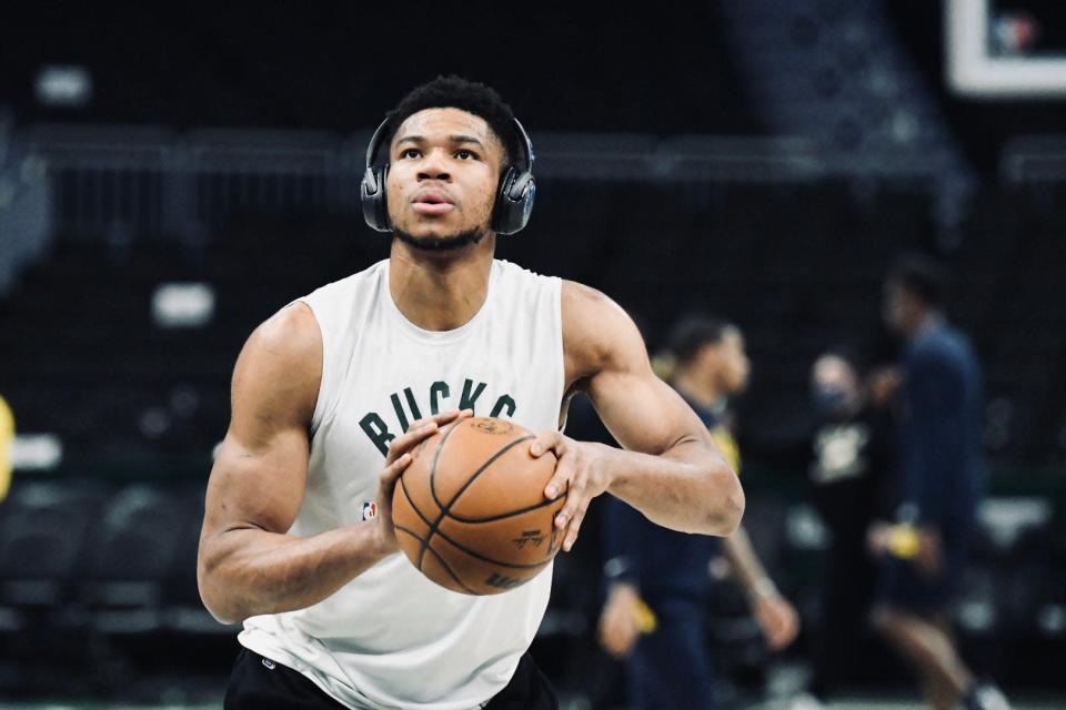 Milwaukee's Giannis Antetokounmpo shoots a free throw during warmups as the Bucks host the Pacers at Fiserv Forum in Milwaukee on Feb. 15, 2022.