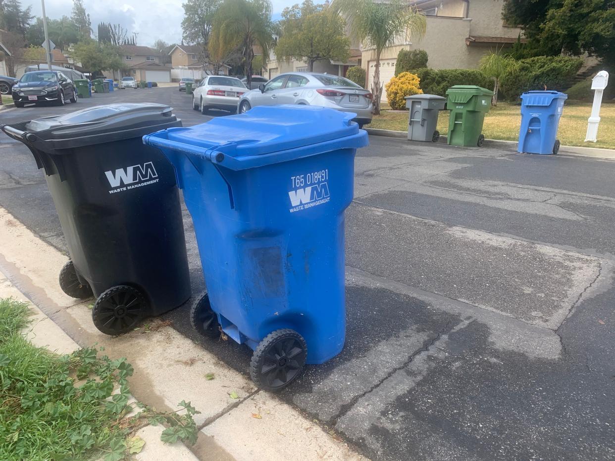 Colored bins in a Thousand Oaks neighborhood, seen in 2021, can help residents sort trash, recycling and green waste.