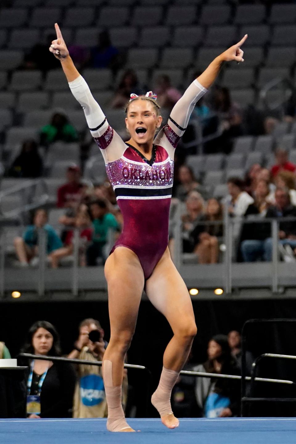OU's Jordan Bowers celebrates after competing in the floor exercise during the semifinals on Thursday.