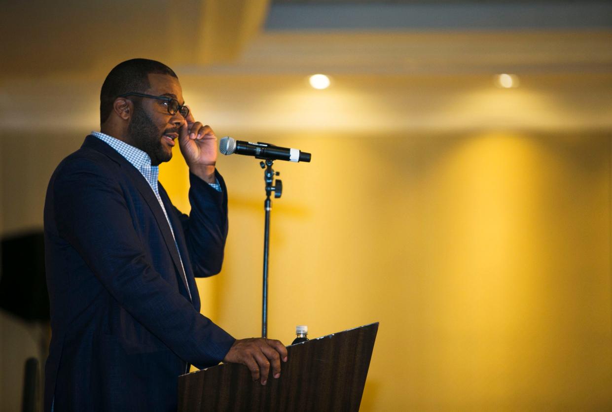 Hollywood entertainer Tyler Perry adjusts his glasses while delivering a speech at the Southern Heritage Classic 2016 Nike Classic Coaches luncheon in the Heritage Ballroom at the Sheraton Hotel in Downtown Memphis on Sept. 9, 2016. Perry shared his personal story of overcoming adversity, gaining success and working alongside Oprah Winfrey. "Continue to know your purpose," Perry said near the end of his talk. "Continue to do what you do."