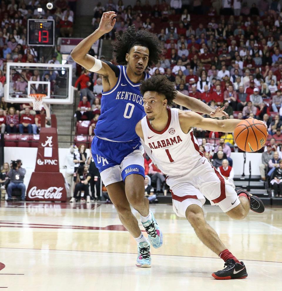 Jan 7, 2023; Tuscaloosa, AL, USA;  Alabama guard Mark Sears (1) dribbles past Kentucky forward Jacob Toppin (0) at Coleman Coliseum. 