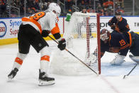 Philadelphia Flyers' Claude Giroux (28) scores a goal on Edmonton Oilers goalie Mikko Koskinen (19) during the first period of an NHL hockey game, Wednesday, Oct. 27, 2021 in Edmonton, Alberta. (Jason Franson/The Canadian Press via AP)