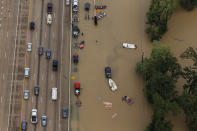 <p>Vehicles sit on the interstate 10 as it closes because portions of it is flooded, in Houston, Texas, on Aug. 29, 2017. (Photo: Marcus Yam / Los Angeles Times via Getty Images) </p>