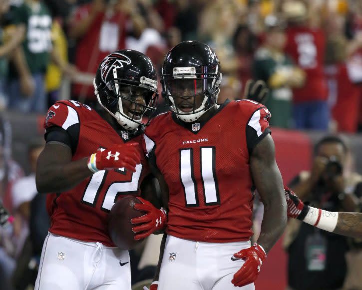 Oct 30, 2016; Atlanta, GA, USA; Atlanta Falcons wide receiver Mohamed Sanu (12) celebrates his touchdown catch with wide receiver Julio Jones (11) in the fourth quarter of their game against the Green Bay Packers at the Georgia Dome. The Falcons won 33-32. Mandatory Credit: Jason Getz-USA TODAY Sports