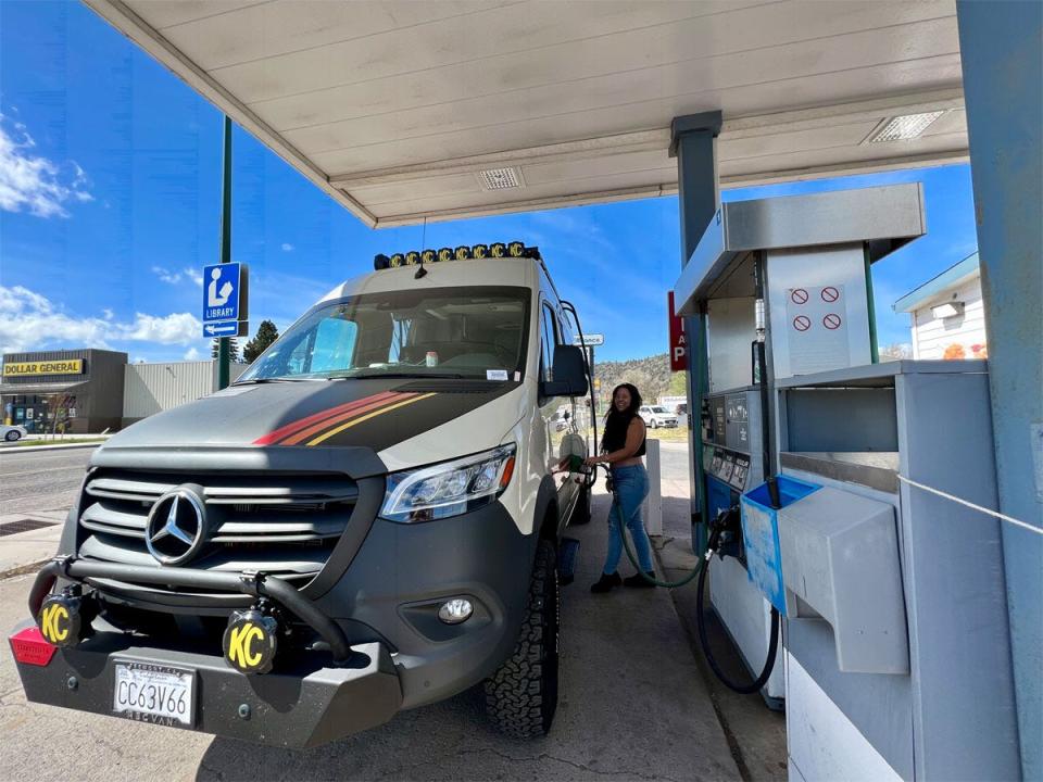 ashley probst filling up the van's gas tank at station