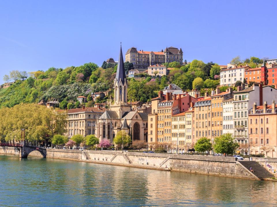 A photo of Lyon, France and a body of water.