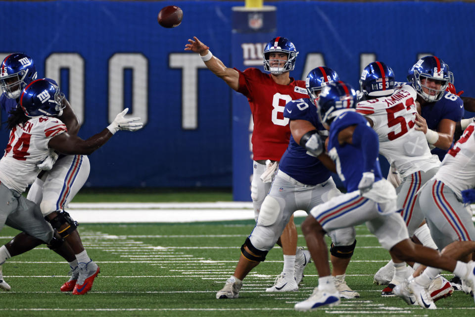 New York Giants quarterback Daniel Jones (8) passes during a scrimmage at the NFL football team's training camp in East Rutherford, N.J., Friday, Aug. 28, 2020. (AP Photo/Adam Hunger)