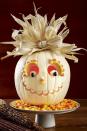 <p>This candy-filled scarecrow is way too sweet to scare away any trick-or-treaters. Follow a classic pumpkin face design, and then make its features pop with candy corn in assorted shapes and sizes. </p>