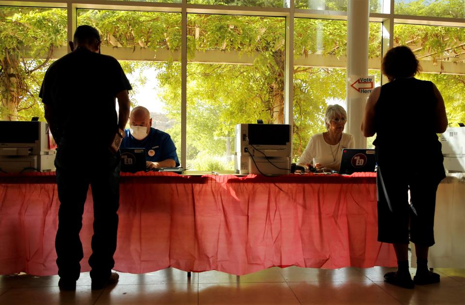 Election clerks at the Farmington Museum at Gateway Park help voters during the 2022 New Mexico primary election on June 7.