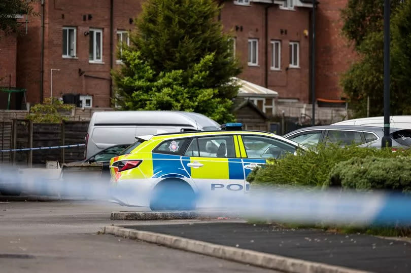 A police scene at a car park in Moston