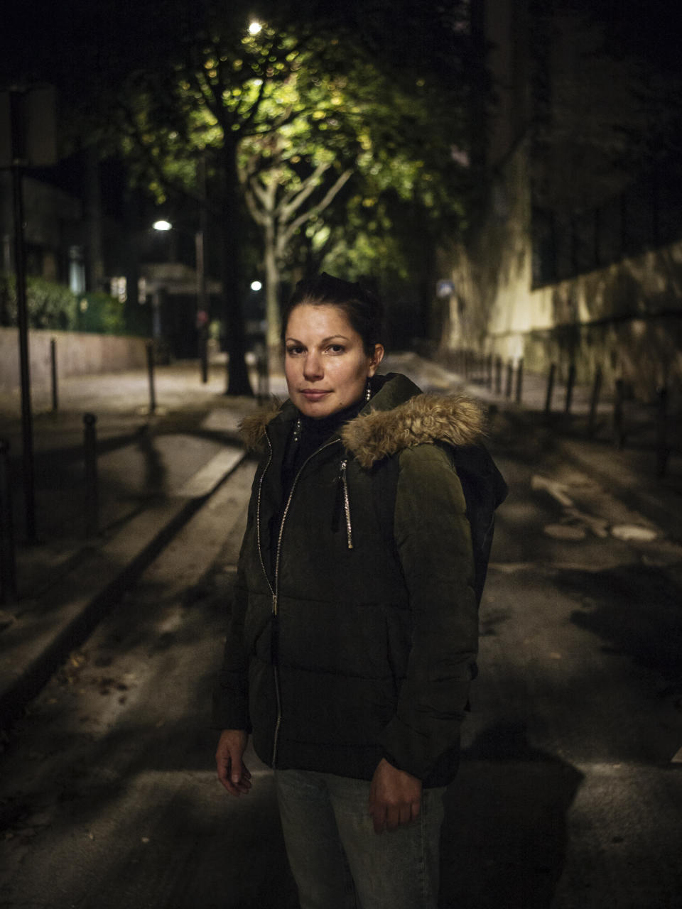 In this Oct. 31 2019 photo, Mathilde, 31, a jewelry student from Marseille, poses for a portrait in Paris. Mathilde experienced domestic violence when she was 21. Ten years later, she finally took back control of her life. Pasting is for her the way not to be a victim anymore and take back control of her fear. (AP Photo/Kamil Zihnioglu)