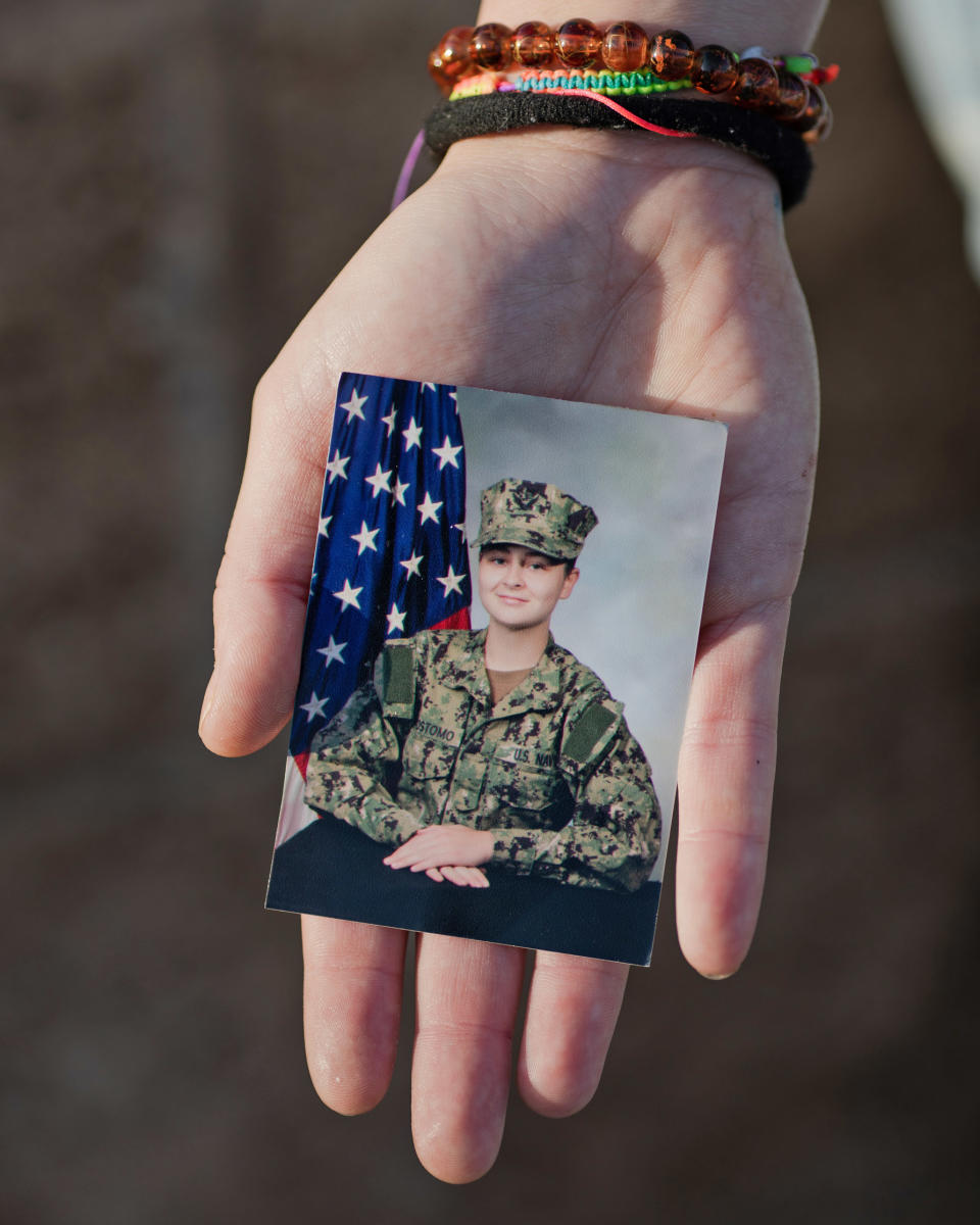 Hannah Crisostomo holds her U.S. Navy portrait. (Alex Welsh for NBC News)