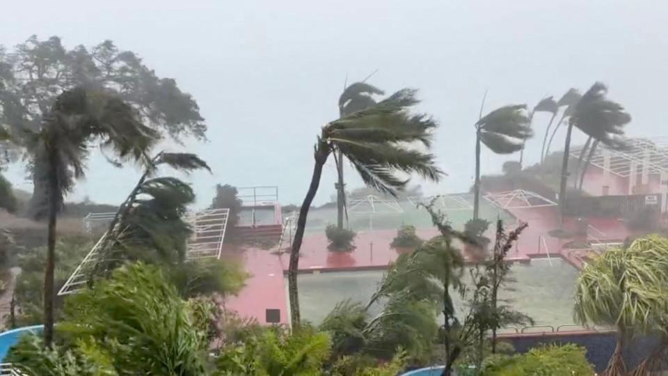 This video grab from the Twitter page of James Reynolds @EarthUncutTV shows tropical storm force winds blowing  across Tumon Bay, Guam (AFP via Getty Images)