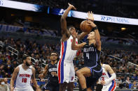 Orlando Magic guard Jalen Suggs (4) drives to the basket past Detroit Pistons center Isaiah Stewart during the second half of an NBA basketball game Friday, Jan. 28, 2022, in Orlando, Fla. (AP Photo/Scott Audette)