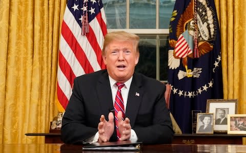 President Donald Trump speaks from the Oval Office of the White House as he gives a prime-time address about border security - Credit: Reuters