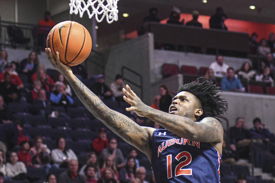 Auburn guard Zep Jasper (12) scores against Mississippi during the first half of an NCAA college basketball game in Oxford, Miss., Saturday, Jan. 15, 2022. (AP Photo/Bruce Newman)