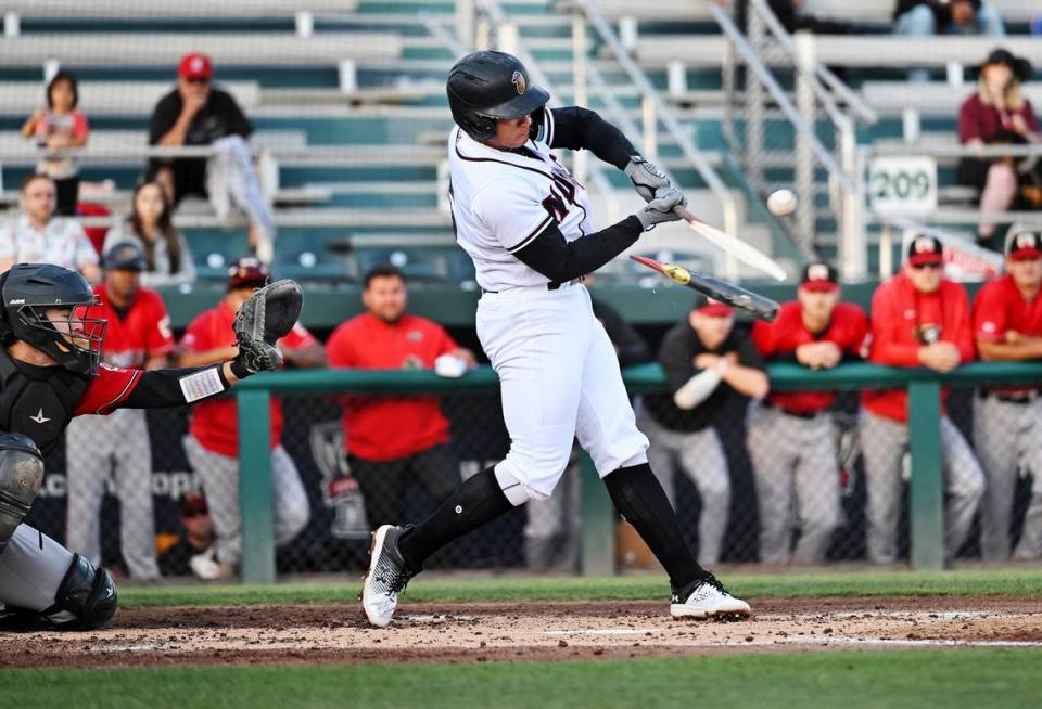 The Modesto Nuts’ Milkar Perez fights through a broken bat for a single during the game with the Fresno Grizzlies at John Thurman Field in Modesto, Calif., Thursday, June 22, 2023. Fresno won the game 4-3.