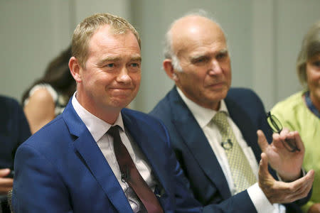 Tim Farron the outgoing leader of Britain's Liberal Democrats sits next to the new leader Vince Cable at his appointment in London, July 20, 2017. REUTERS/Neil Hall