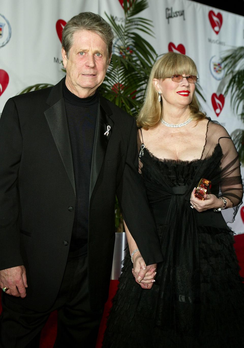 HOLLYWOOD - FEBRUARY 11: Musician Brian Wilson and his wife Melinda arrive at the MusiCares 2005 Person of the Year Tribute to Brian Wilson at the Palladium on February 11, 2005 in Hollywood, California. (Photo by Kevin Winter/Getty Images) *** Local Caption *** Brian Wilson;Melinda Wilson ORG XMIT: 52164434 GTY ID: 52164434KW009_MusiCares_200