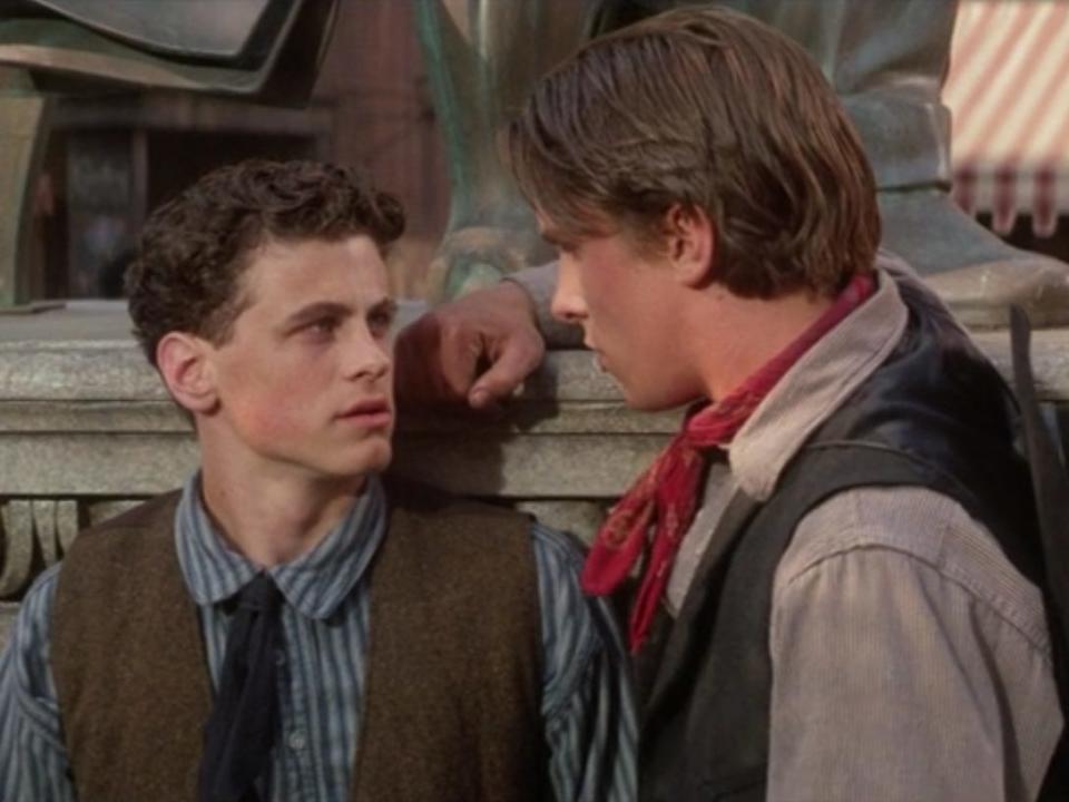 Davey and Jack Kelly in Newsies looking at each other