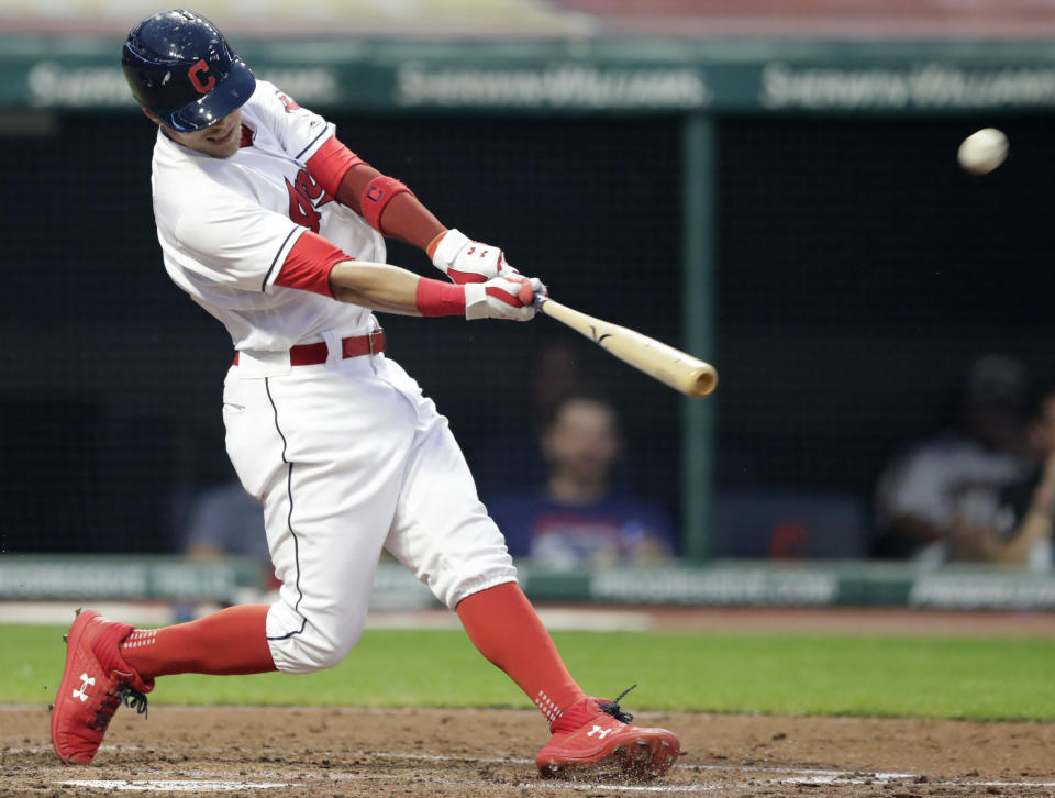 Cleveland Indians' Brandon Guyer hits a two-run home run off Minnesota Twins starting pitcher Kyle Gibson in the fourth inning of a baseball game Monday, Aug. 6, 2018, in Cleveland. Roberto Perez also scored on the play. (AP Photo/Tony Dejak)