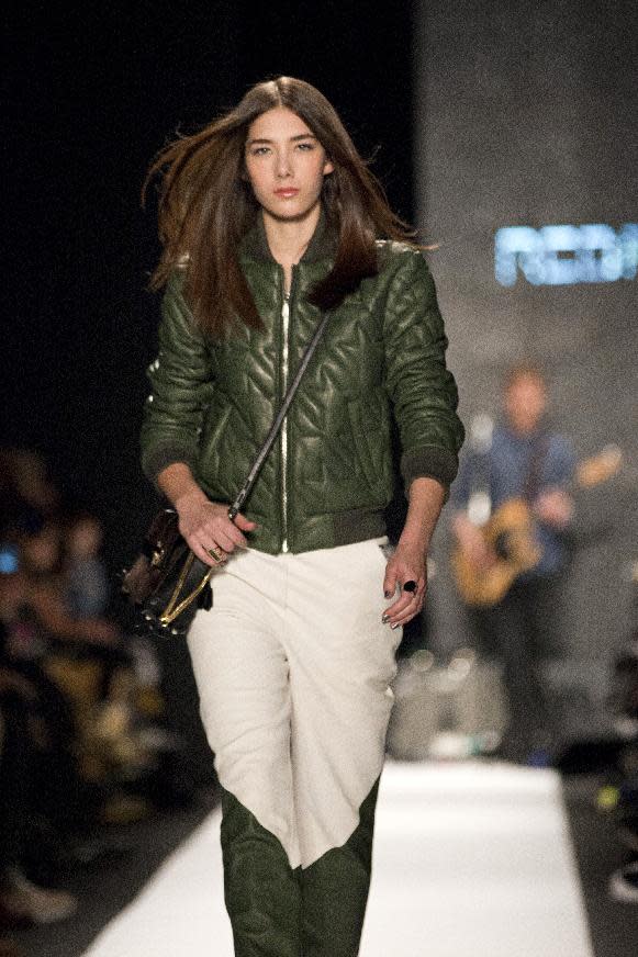 A model walks the runway during the Rebecca Minkoff Fall 2013 fashion show during Fashion Week, Friday, Feb. 8, 2013, in New York. (AP Photo/Karly Domb Sadof)