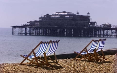 Deck chairs on Brighton beach - Credit: Heathcliff O'Malley